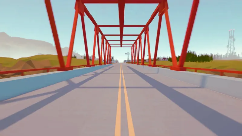 A red steel bridge on the road out of town